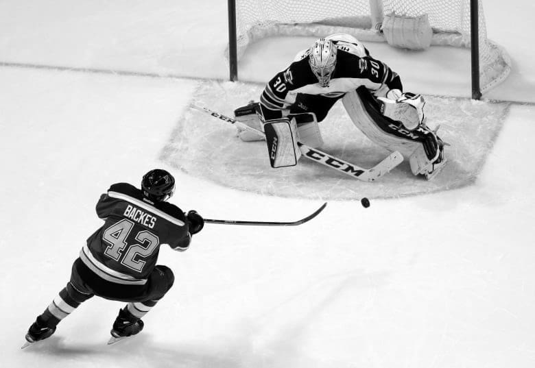 Hockey Goalie Stopping Shot 1