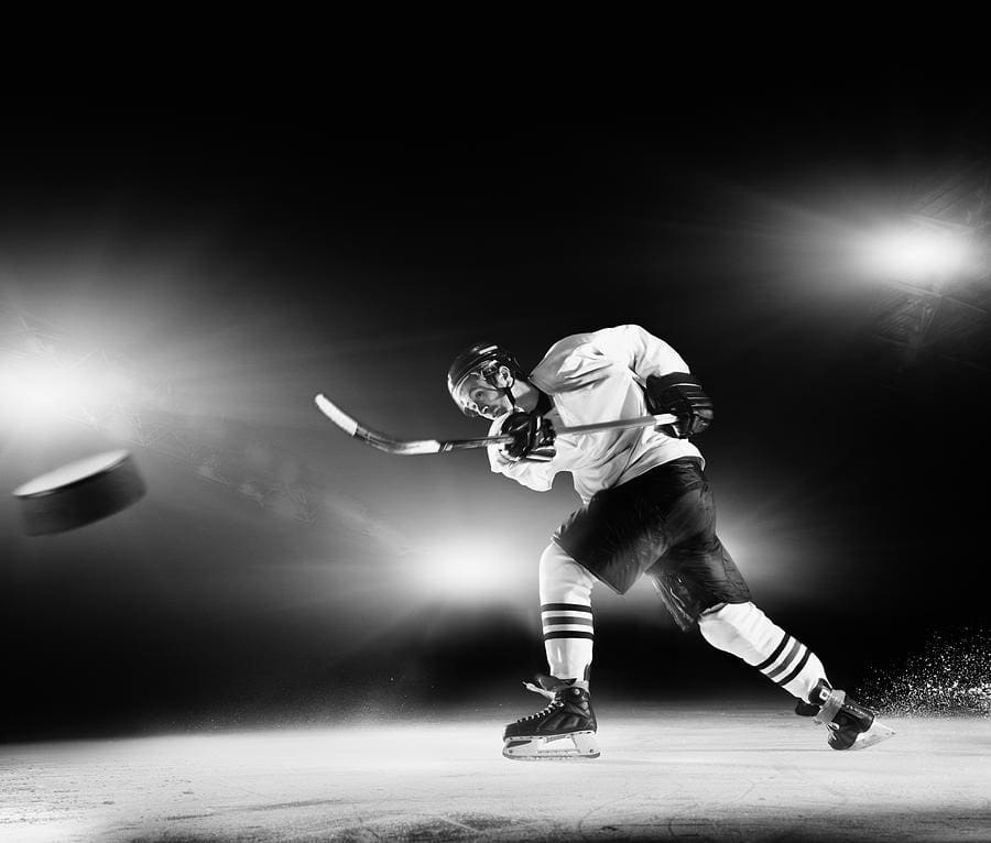 Hockey Player Shooting Puck 2