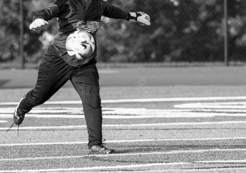 Soccer Goalie Kicking Ball